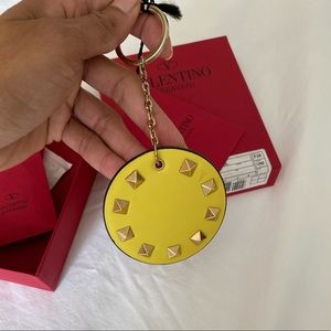 bag charm, new and with box.